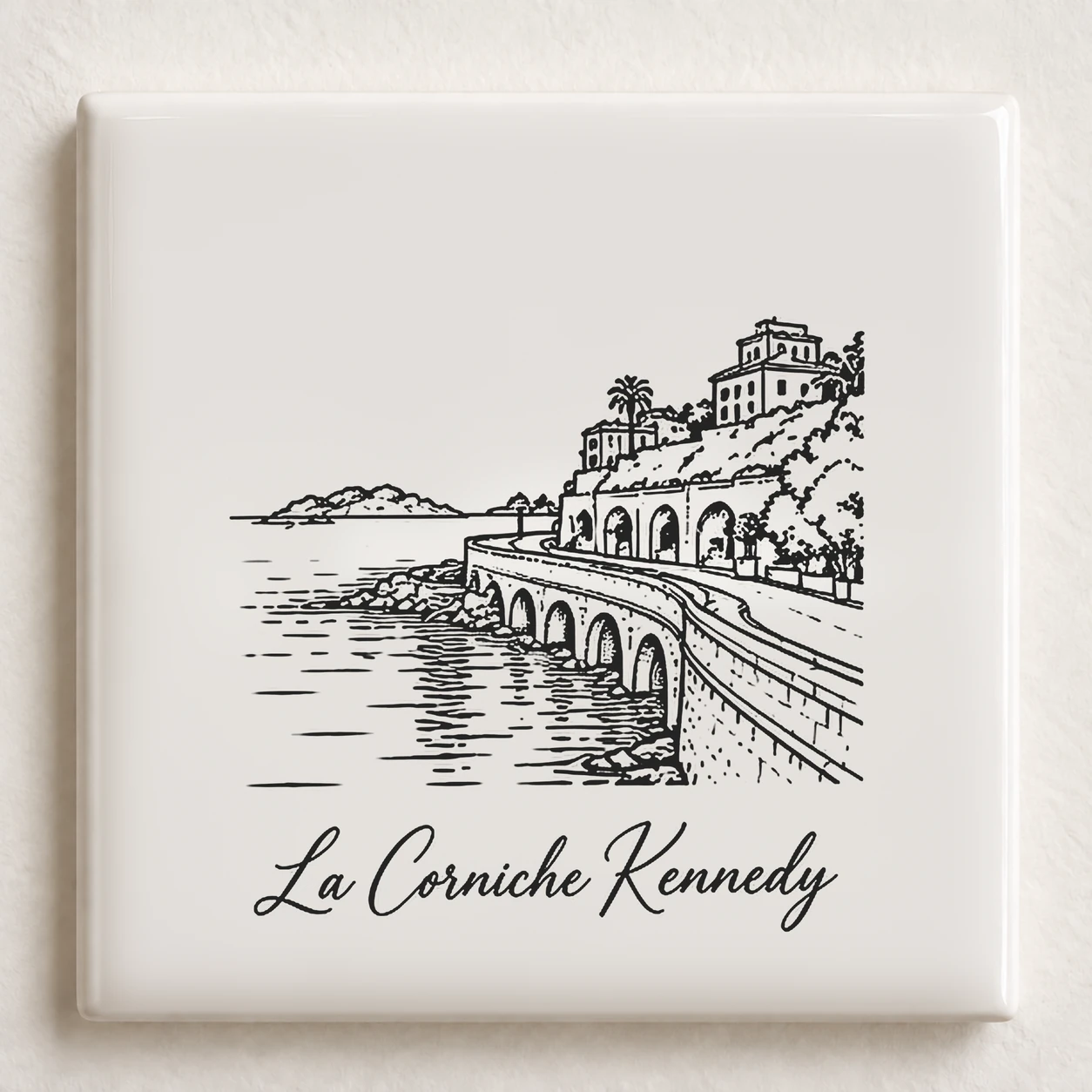 Carreau décoratif K-Reau « La Corniche Kennedy » en céramique blanche, dessin au trait noir et nom calligraphié